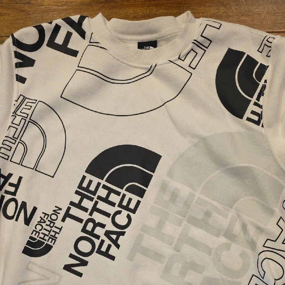 The North Face Men's White and Black All Over‎ Graphic Sweatshirt M